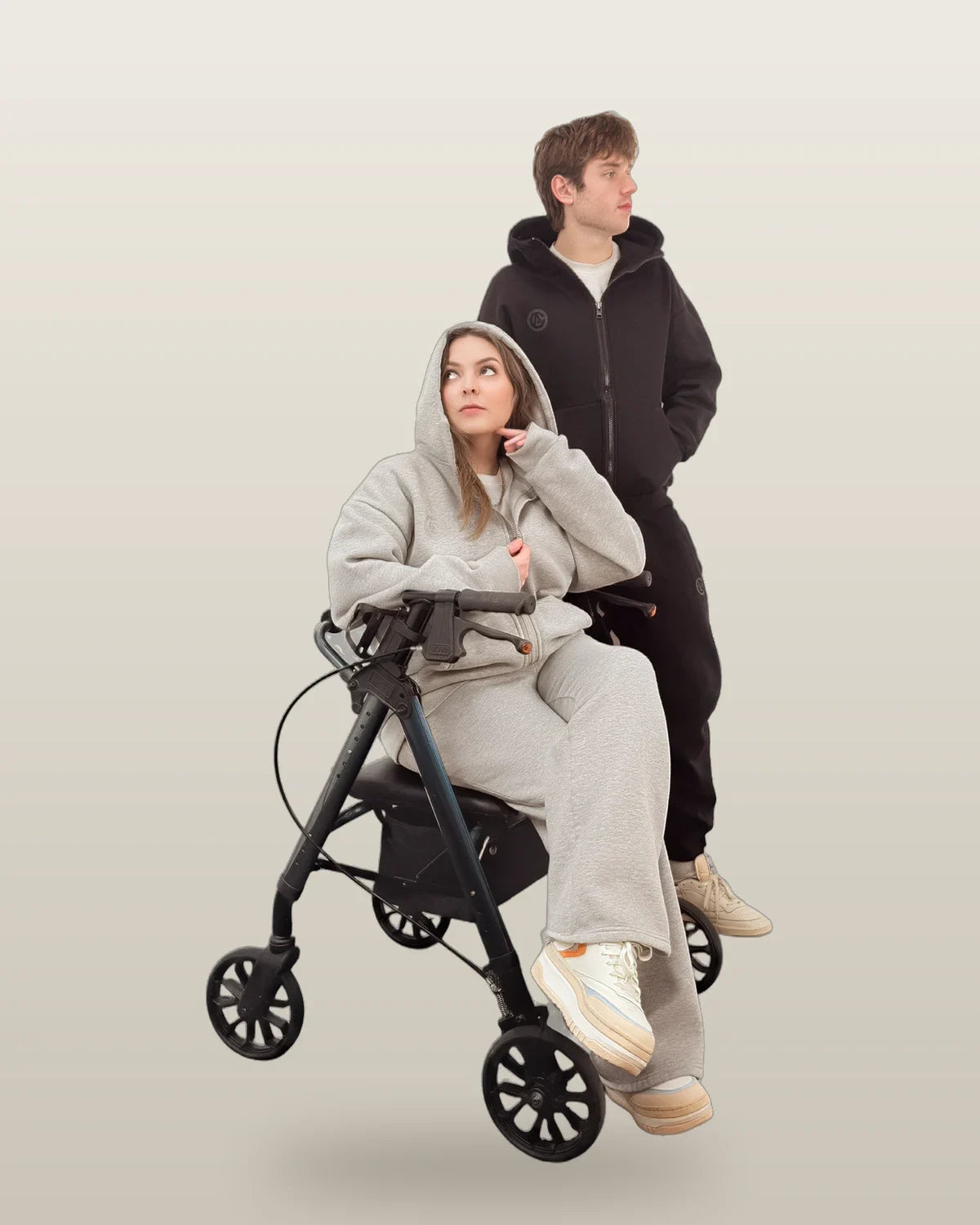 A woman in a gray FREEDOM set seated on a rollator