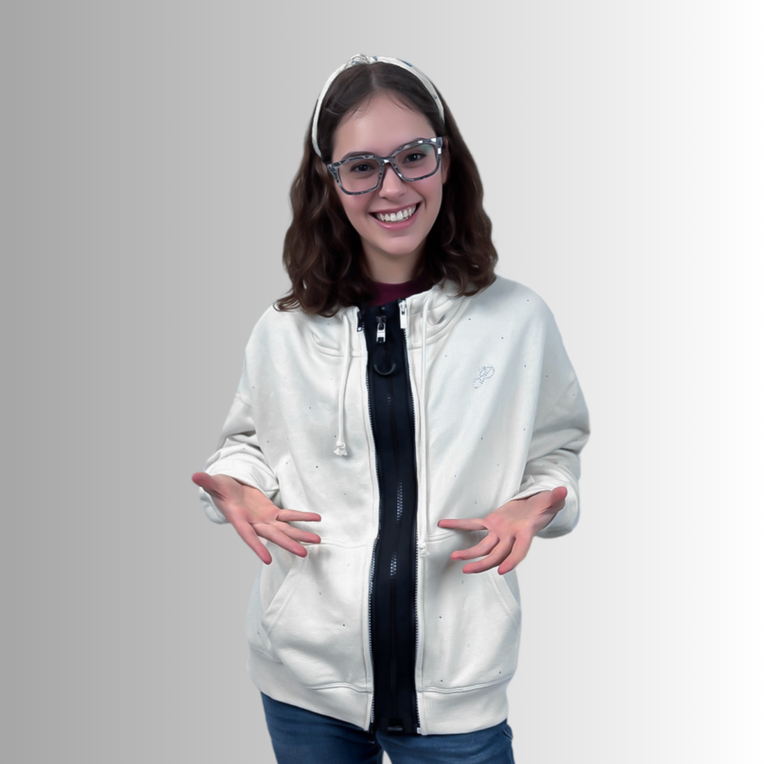 Person wearing a white zip hoodie fitted with a black ZipperBuddy MagZip magnetic zipper