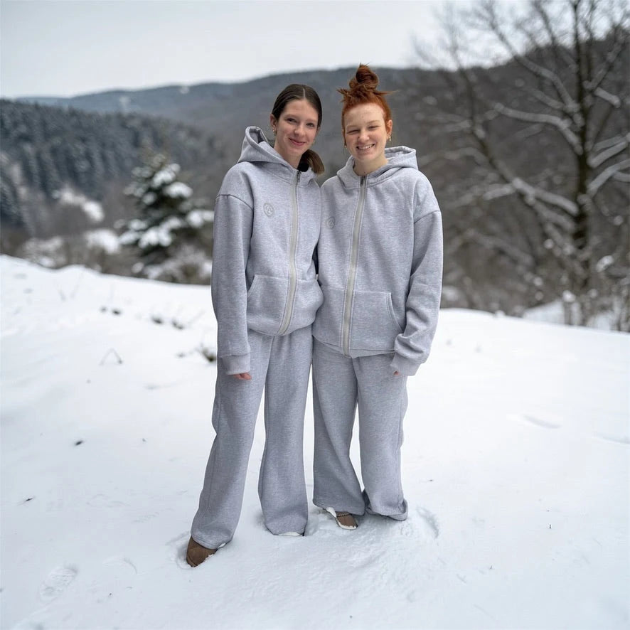 Two teens in gray FREEDOM sets in the snow