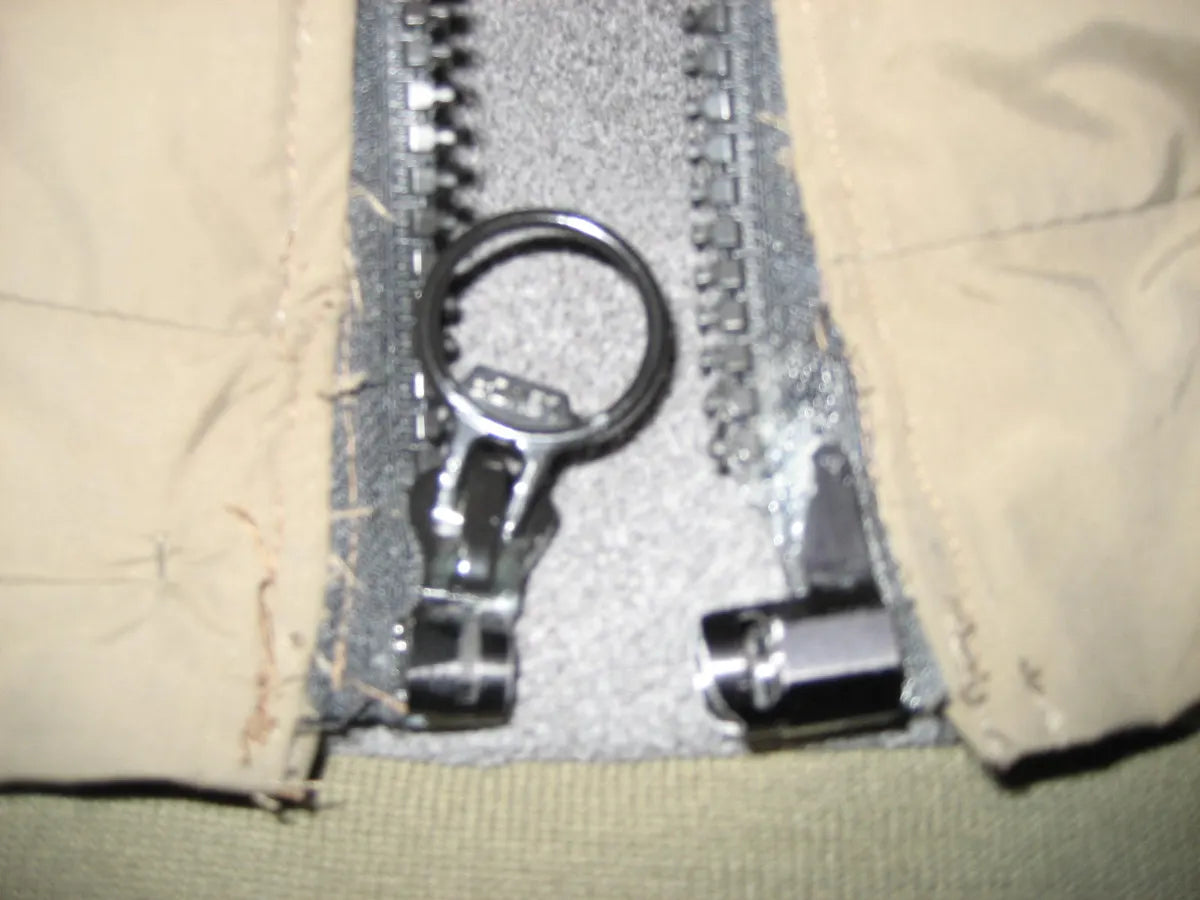 Early prototype bases sewn into a tan jacket
