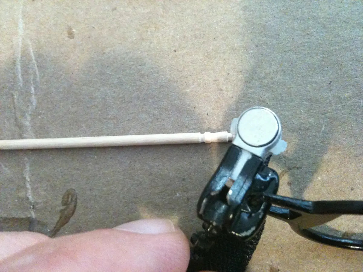 An early metal MagZip base, held in fingers